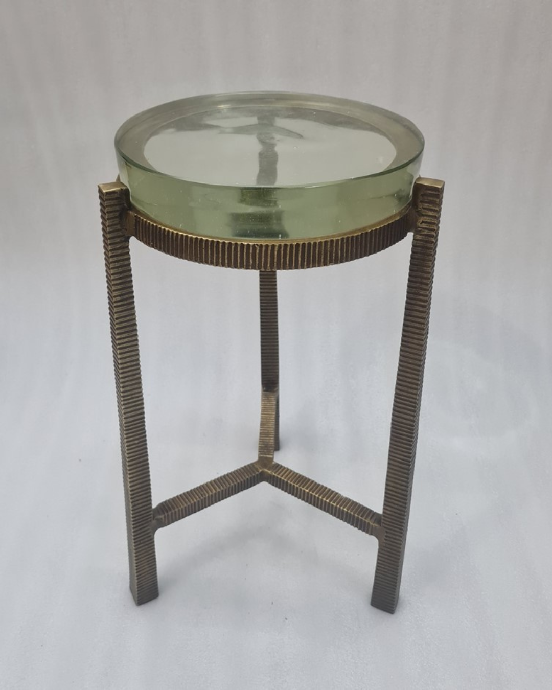 Glass-top side table — original product on white