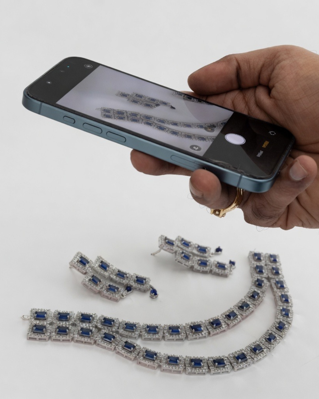 A phone capturing a jewellery product photo