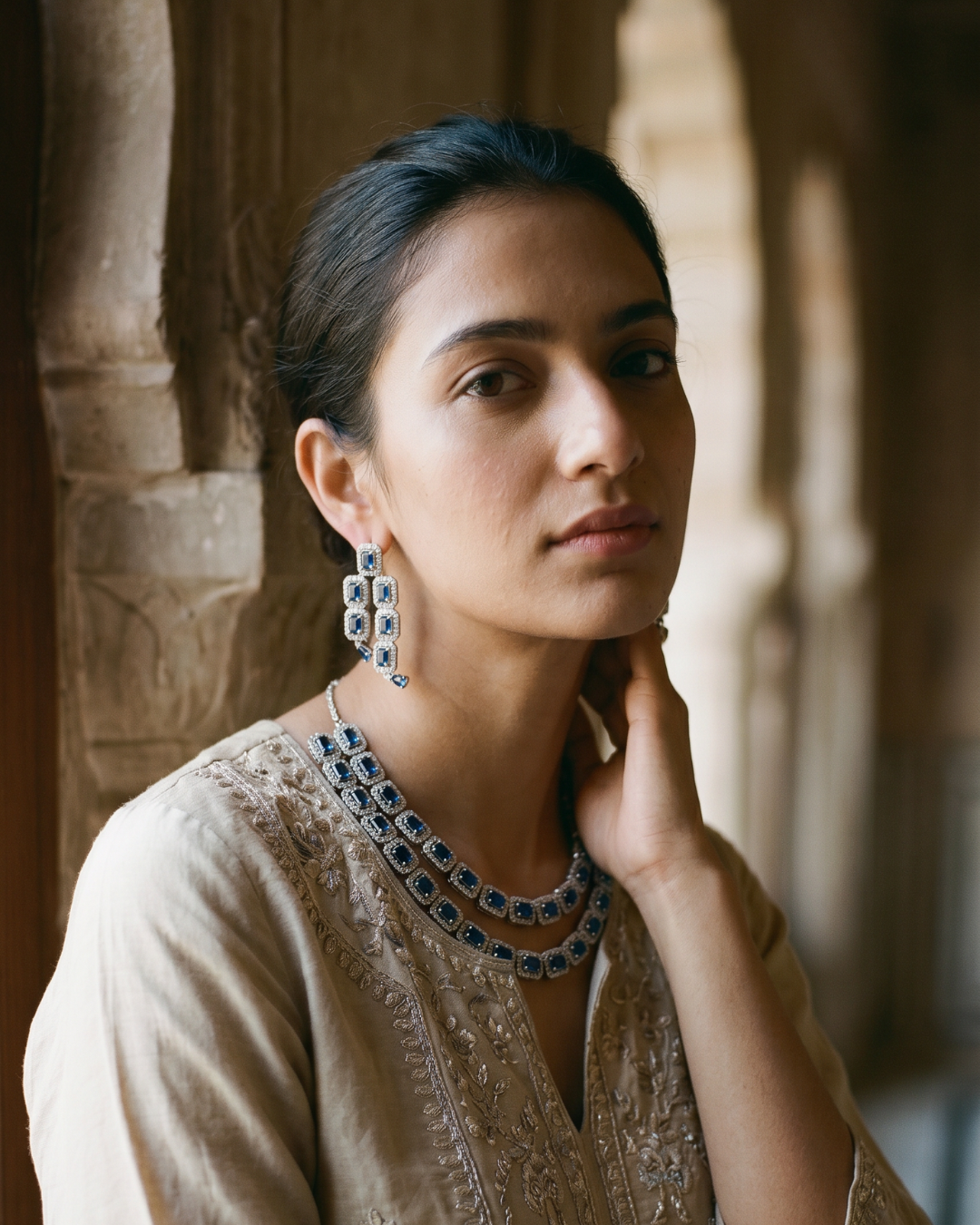 Model wearing the jewellery in a heritage interior