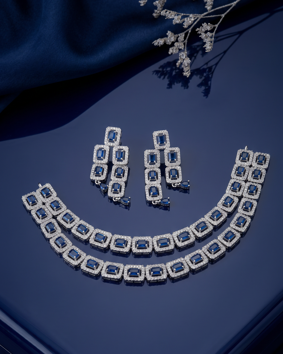 Sapphire jewellery set on luxe dark velvet